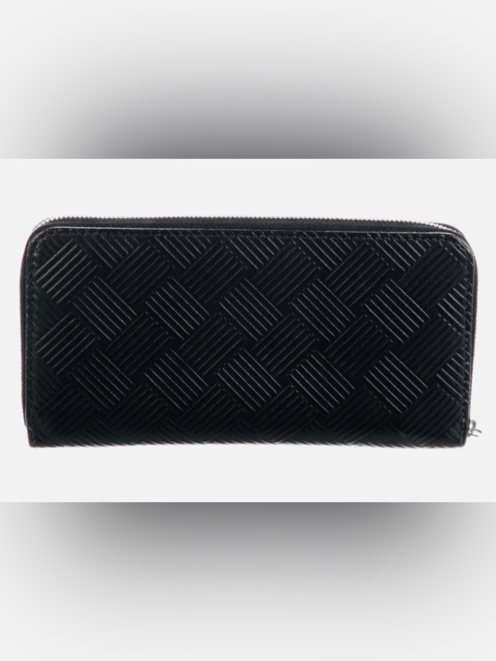 BOTTEGA VENETA Black Zip Around Wallet in Intrecciato Debossed Calfskin. UNISEX.